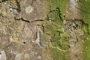 a worn, old concrete wall