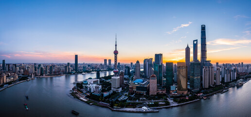 Aerial view of city skyline and modern buildings in Shanghai at sunrise, China.