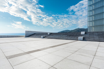 Empty square floor and lake with mountain background