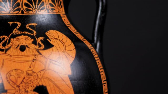 Dolly of a replica Greek Amphora or Vase with Ancient Greek mythological creature on it - Medium Close Up Right to Left