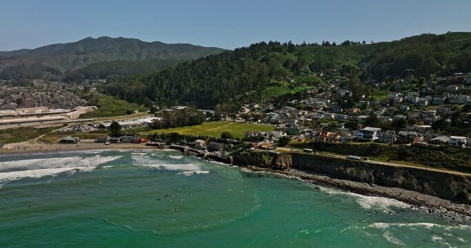 Pacifica California Aerial v2 cinematic drone flyover and along crescent shaped beach shore from pedro point towards linda mar neighborhood on a sunny day in summer - Shot with Mavic 3 Cine - May 2022