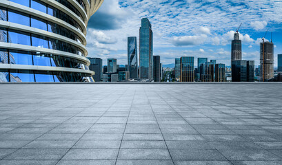 Empty square floor and city skyline with modern buildings in Ningbo, Zhejiang Province, China.