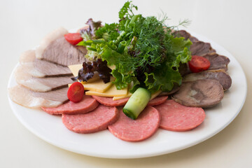 salad of sausage, cheese, vegetables and herbs