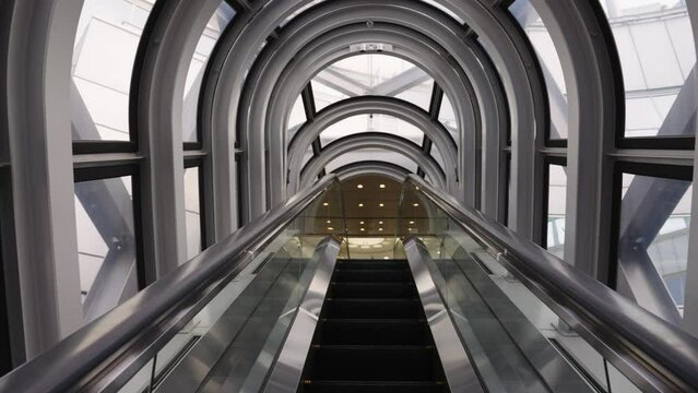 Rising through Escalator Towards Top Floor of Sky Building
