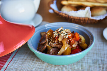 lagman in a cup with a red lid