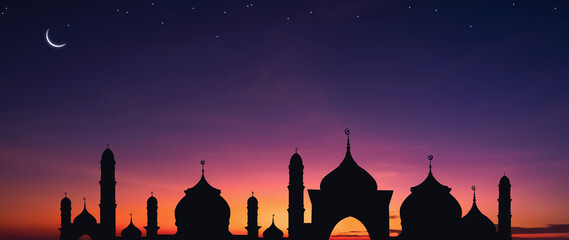 Panoramic view of Silhouette Mosque dome with Crescent moon and stars on Twilight sky background in...