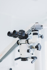 Dental microscope in a modern dental office. Modern dental treatment.