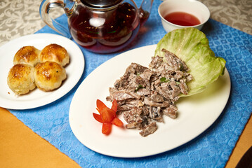 meat in mushroom sauce, with vegetables and tea