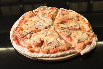 tasty pizza on a black background