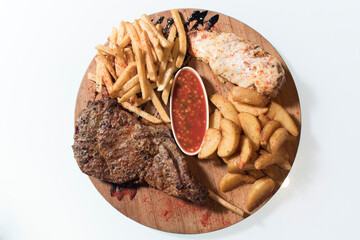 Obraz premium steak, fried french fries, fried meat in cheese, sauce, white background