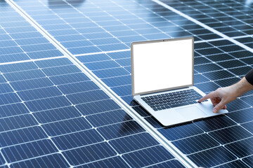 Laptop with blank screen on a solar panel