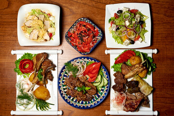 meat dishes top view, on a wooden background