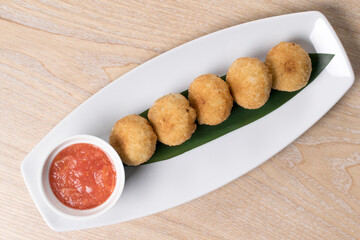 fried pies sauce on a white plate