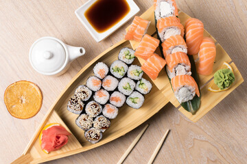 Fototapeta na wymiar japanese sushi, rolls on a wooden structure