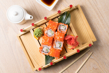 japanese sushi, rolls on a wooden structure