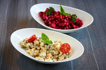 Olivier salad on a marble background