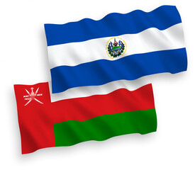 National vector fabric wave flags of Sultanate of Oman and Republic of El Salvador isolated on white background. 1 to 2 proportion.