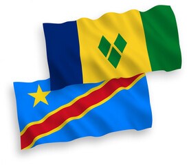 National vector fabric wave flags of Saint Vincent and the Grenadines and Democratic Republic of the Congo isolated on white background. 1 to 2 proportion.