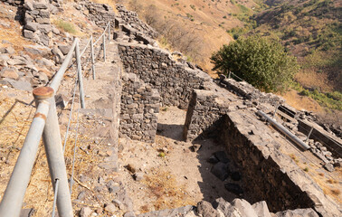 Remains  of buildings and stone walls on the ruins of the Gamla city, Golan Heights, northern Israel