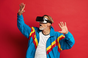 Senior Man Trying VR. Portrait of Amazed Grandfather Discovering New Technologies Wearing Virtual...
