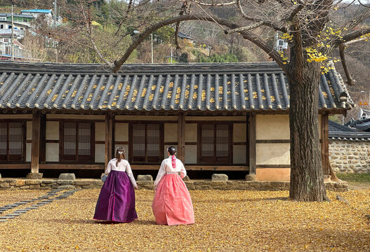 Two Korean women wearing hanbok at Jeonjuhyanggyo Local Confucian School in Jeonju, South Korea.