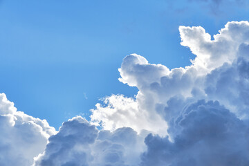 Naklejka na ściany i meble white cumulus clouds with blue sky in the background