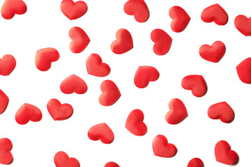 randomly distributed red hearts on a pure white background from above