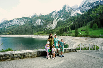 Fototapeta na wymiar Mother with four kids at Vorderer Gosausee, Gosau, Upper Austria.