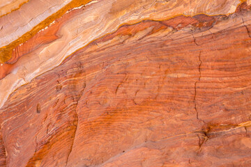 Sandstone rock and mineral layers in Petra, Jordan