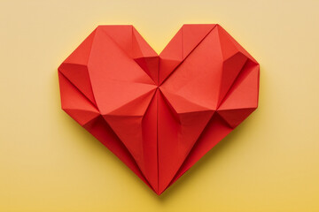 Heart. Love background. Red paper origami heart on yellow background. Valentine card