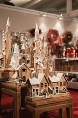 Obraz premium Wooden castle toy constructor at Christmas market vertical shot. Vintage festive wood home decor on holiday season.