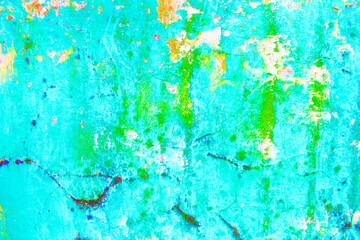 blue and green weathered paint on a wall