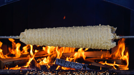 Cooking Sakotis in Vilnius, Lithuania. It is traditional spit cake.  Cuisine.