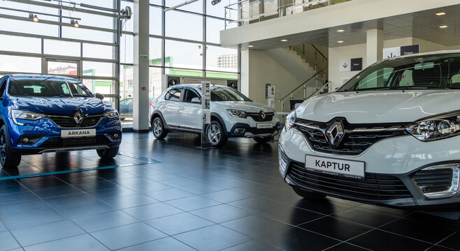Close-up of Renault cars of various modifications and colors in the showroom of the Renault dealership. Renault showroom in Mega Adygea.