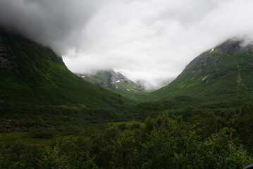 Rough mountain sides around the Trollstigen mountain pass that twists through 11 hairpin bends up the steep mountains of Romsdalen valley, Norway