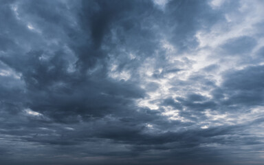 Gloomy heavy dark cloudscape background.