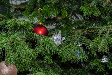 grey dow Christmas tree ornament on a Christmas tree
