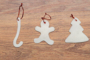 sugar Christmas tree ornaments on a wooden background