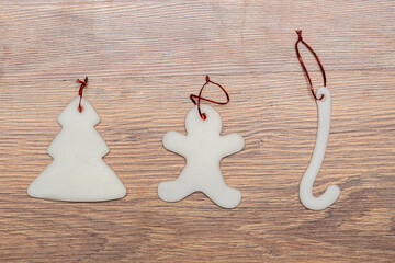 sugar Christmas tree ornaments on a wooden background