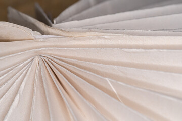 close up of a folded paper Christmas tree decoration