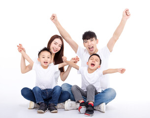 Happy Asian family  sitting on white floor
