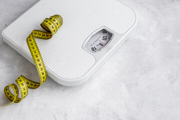 Check your body shape with weight scales and tape measure