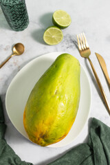 Ripe and freshly cut papaya with its seeds and white background. Fresh and tropical fruit