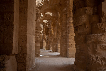 Camels in fron of Amphitheatre of El Jem in Tunisia. Amphitheatre is in the modern-day city of El Djem, Tunisia, formerly Thysdrus in the Roman province of Africa. 