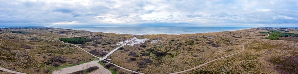 Drone panorama of lighthouse at Lyngvik beach in Denmark during the day