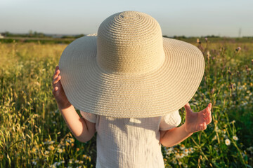 Little boy in big hat in the field. © Татьяна Максимова