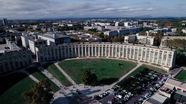 Rotating shot showing plans from artists on the ground in Antigone, Montpellier