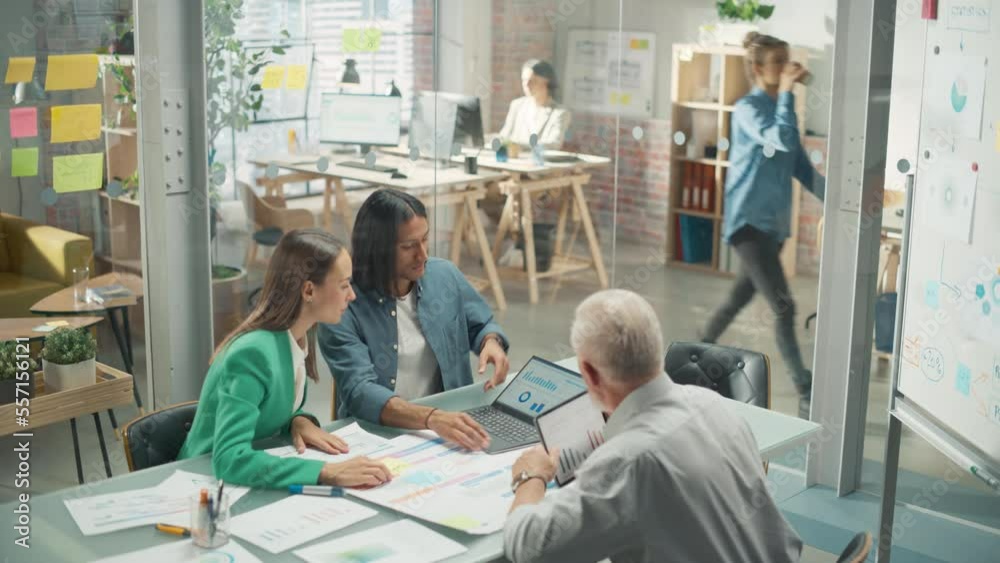 Poster diverse group of people talking in a casual modern meeting room in office using laptop computer. gro