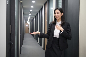 Portrait of successful asian young businesswoman working in her office