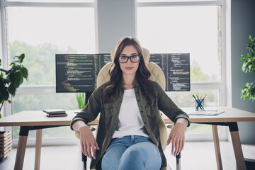 Photo of clever happy lady it specialist wear glasses welcoming you new working place indoors workstation workshop